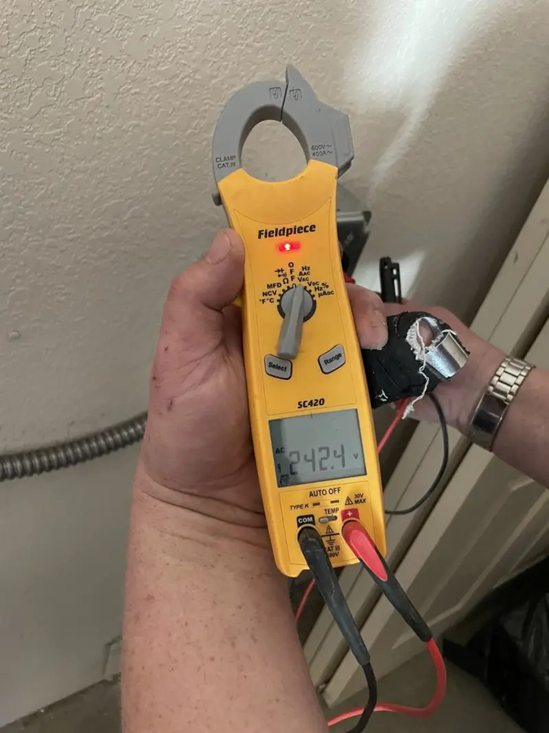 Voltage testing with clamp meter during Ceiling Fan Installation in Daleville